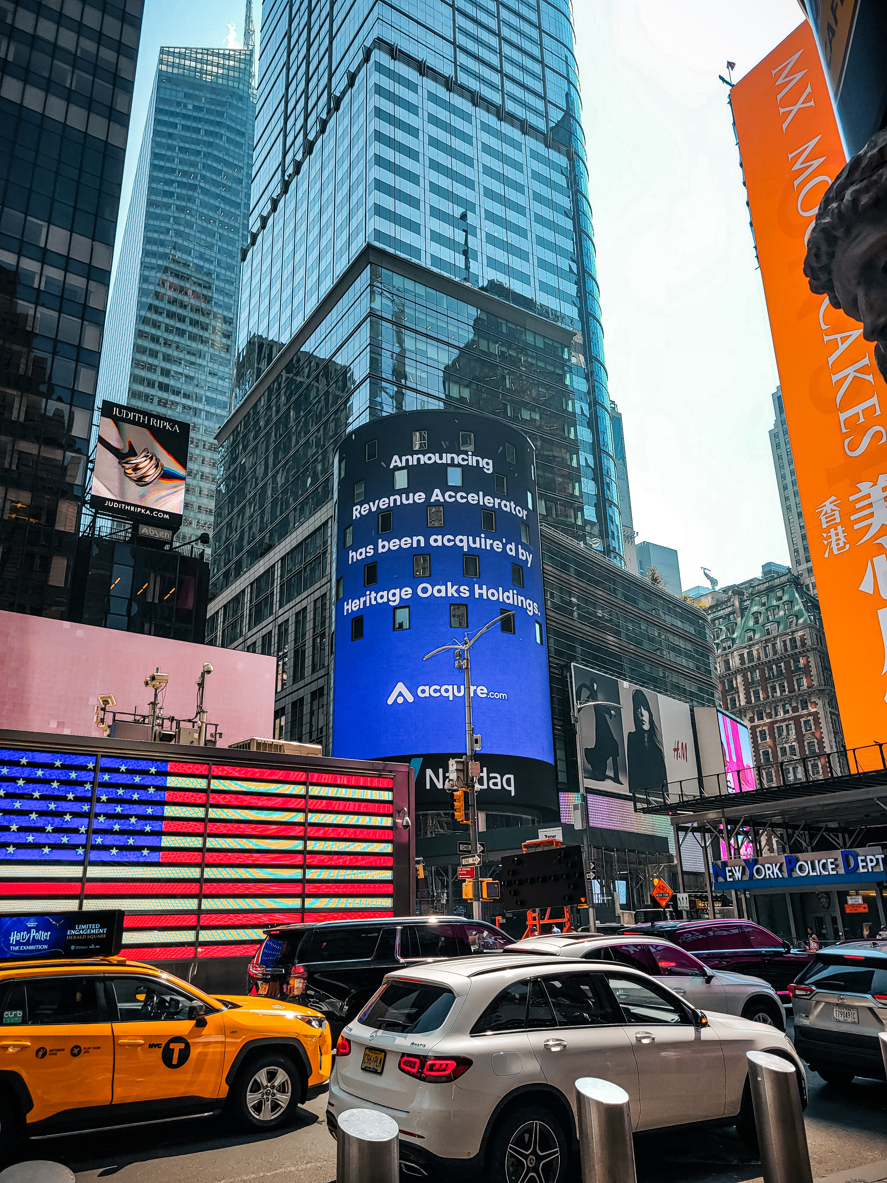 Nasdaq tower announcing the Revenue Accelerator acquisition